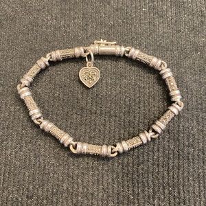 Silver and marcasite bracelet with heart chasm.